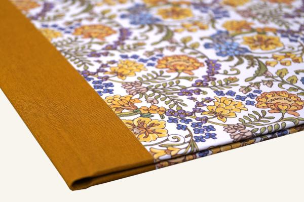 Binder with saffron linen spine